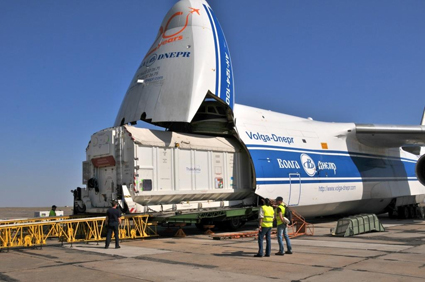 The space satellite in its container loads onto the An-1241